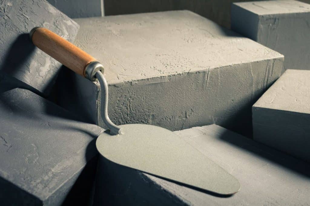 trowel sitting on top of concrete blocks