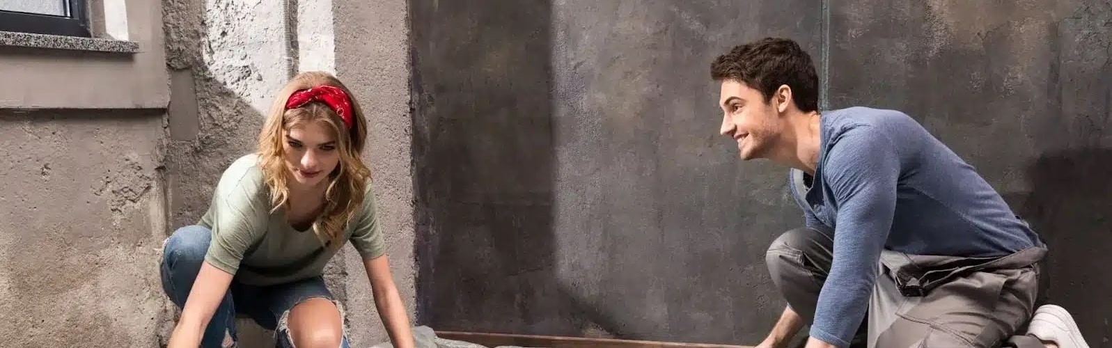 couple creating concrete vapor barrier