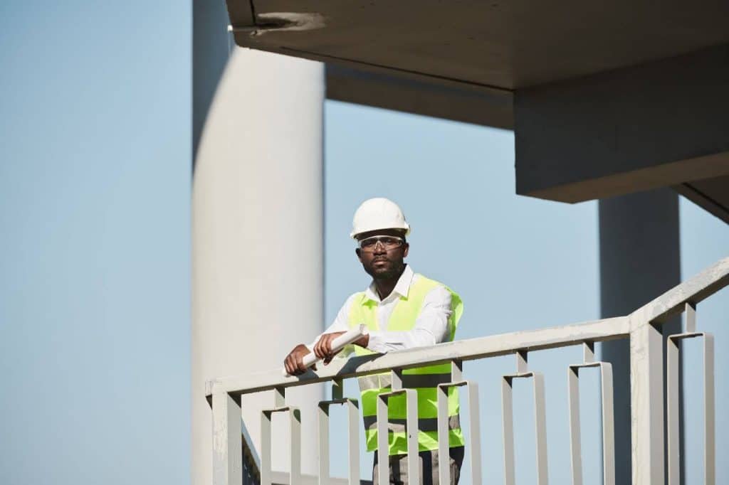 professional inspecting concrete building