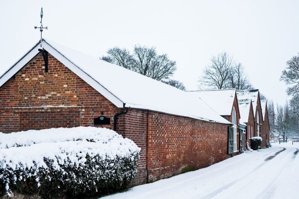 minimum metal roof pitch requirements for snowy conditions
