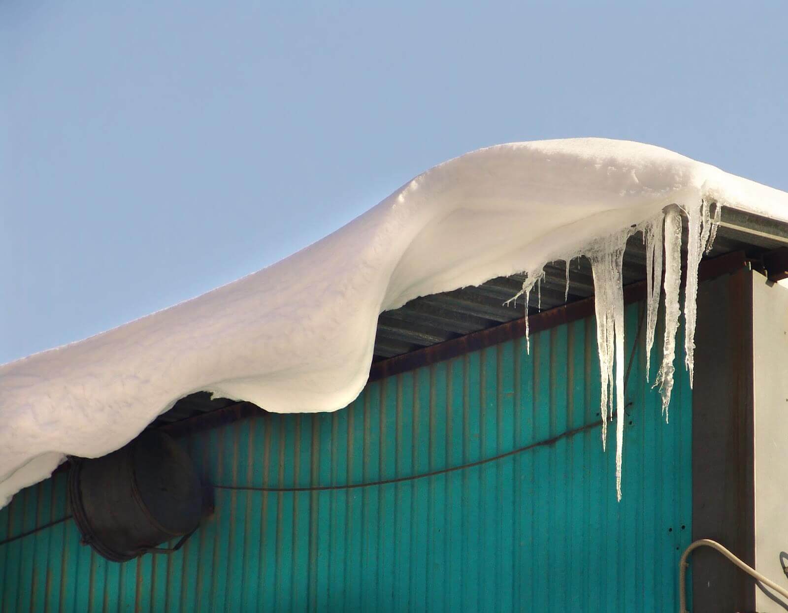 Icicles forming on warehouse roof
