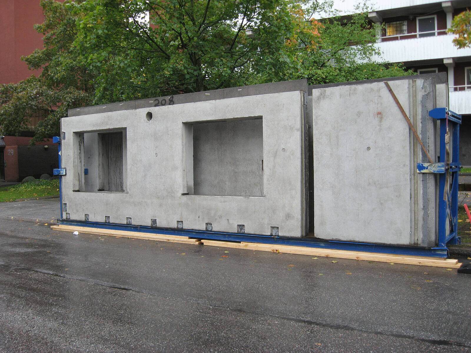 Pre-cast concrete walls in parking lot, ready to be propped up
