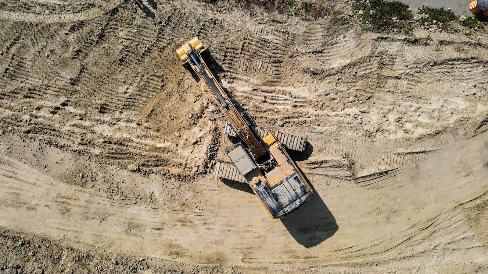 Professionals working sitework construction project with machine